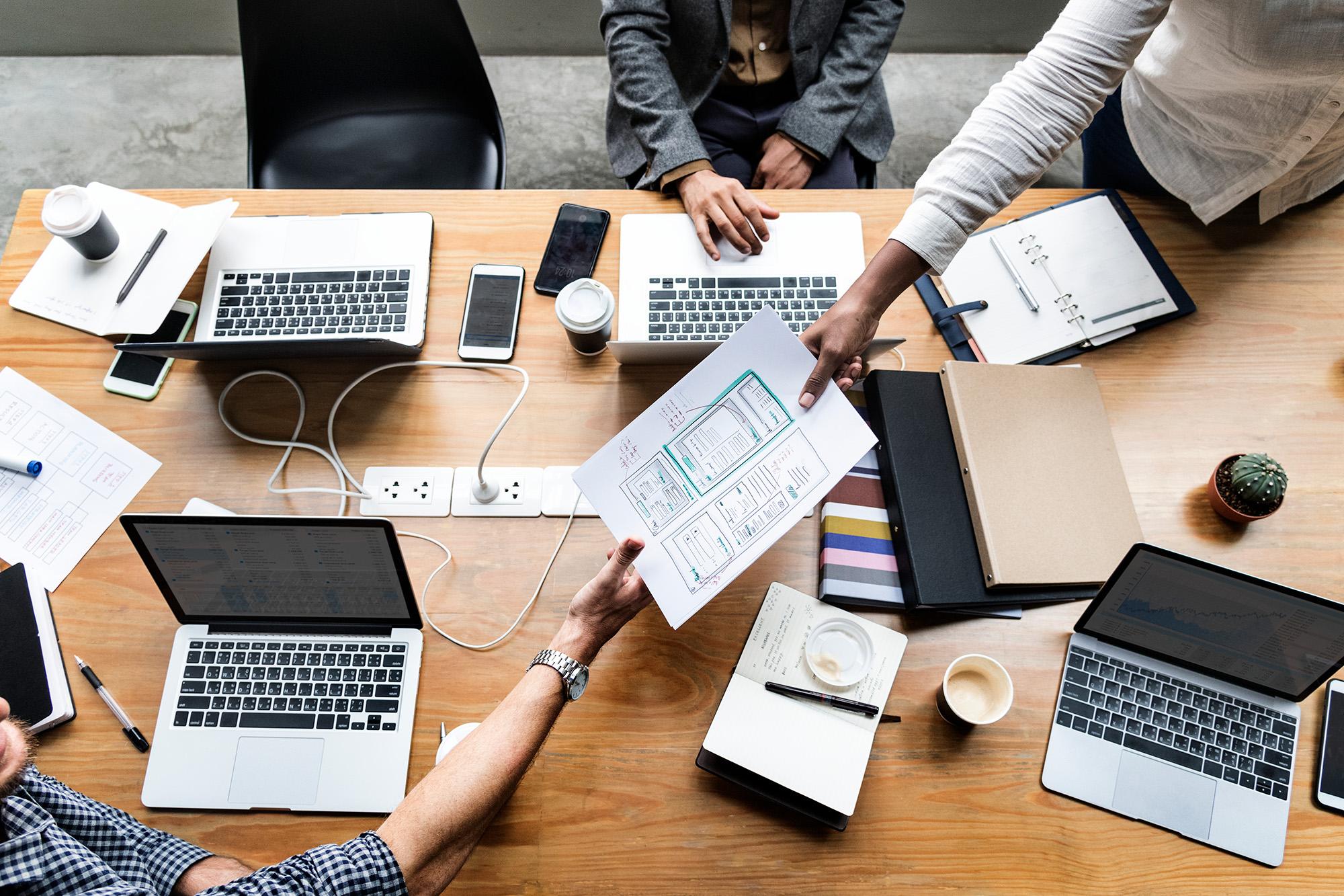 group of people working on a website