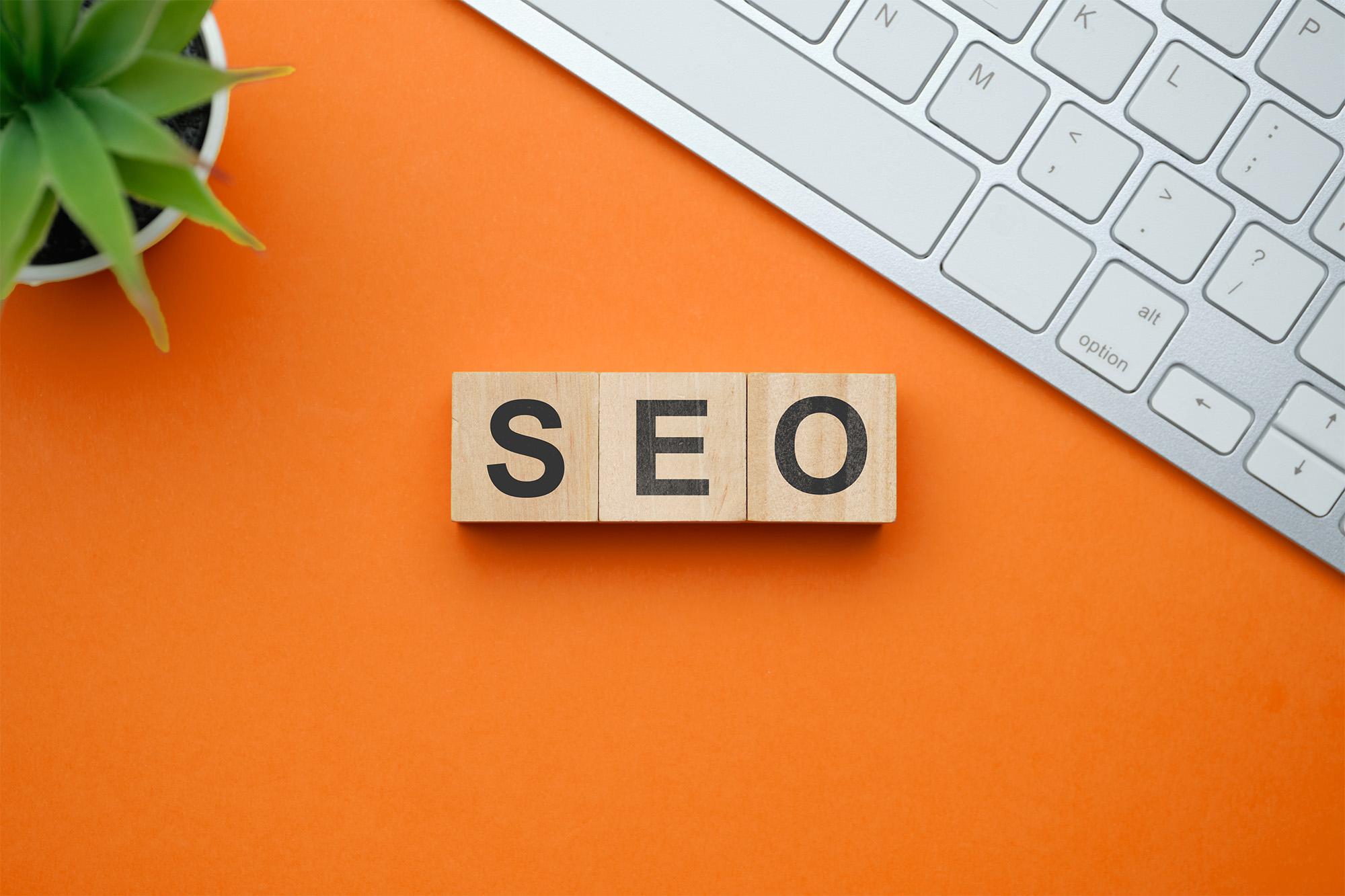 SEO (search engine optimisation) top view on wooden table with blocks