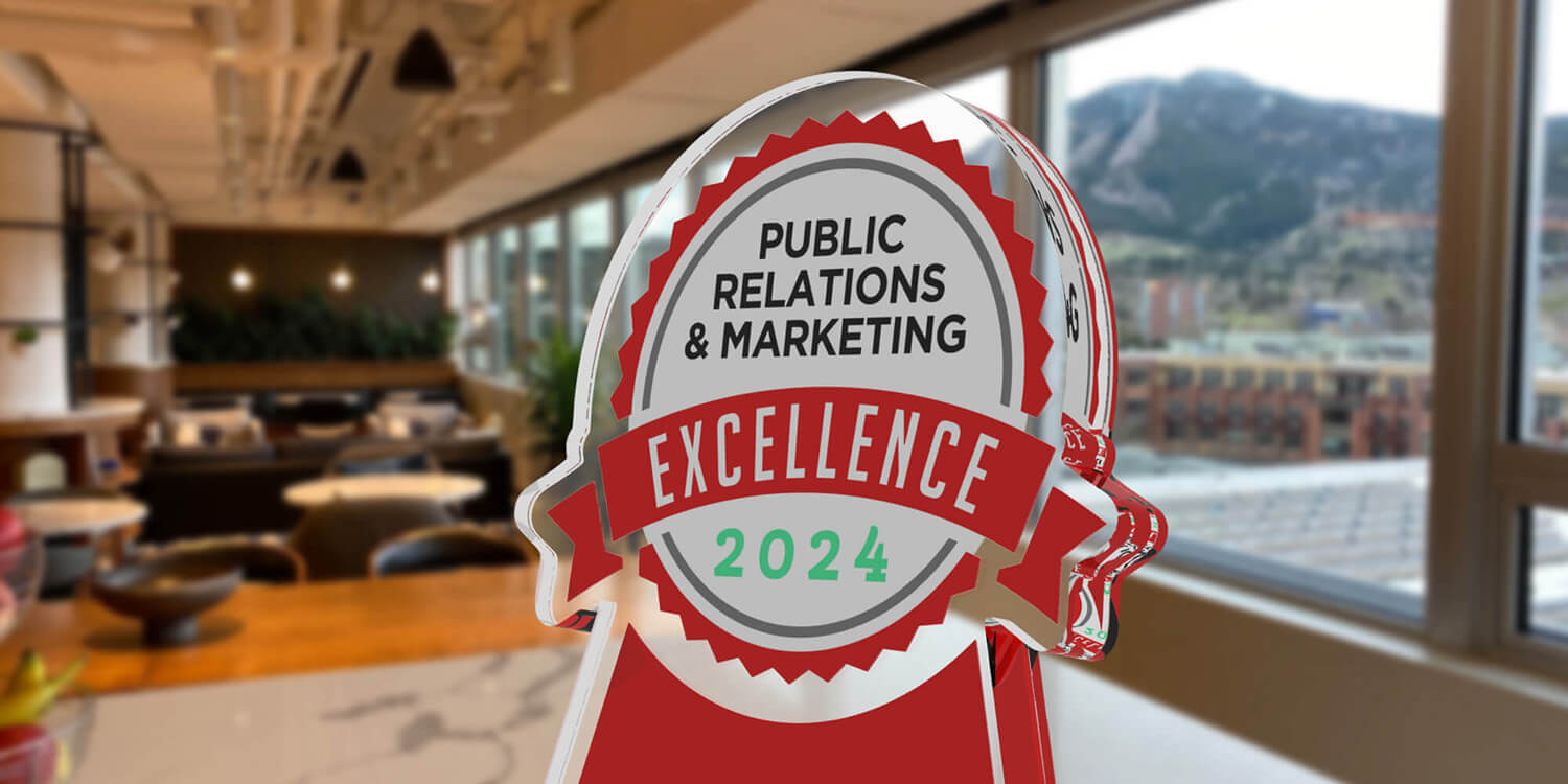 Business Intelligence Group's Public Relations & Marketing Agency of the Year 2024 award trophy in Comprise's Boulder office